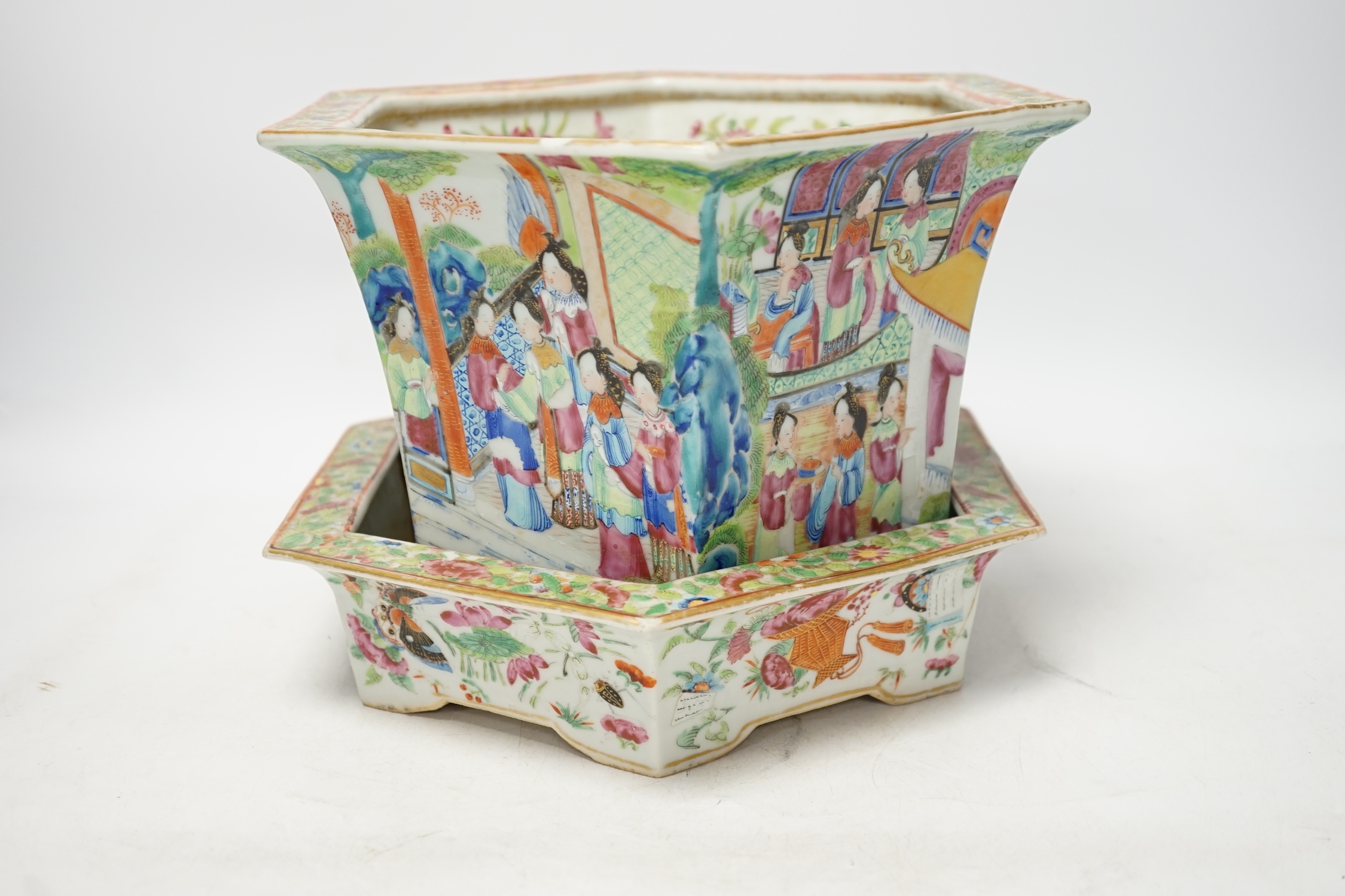 A 19th Chinese Canton decorated famille rose hexagonal planter, with stand, the stand cracked, 19.5cm total. Condition - fair